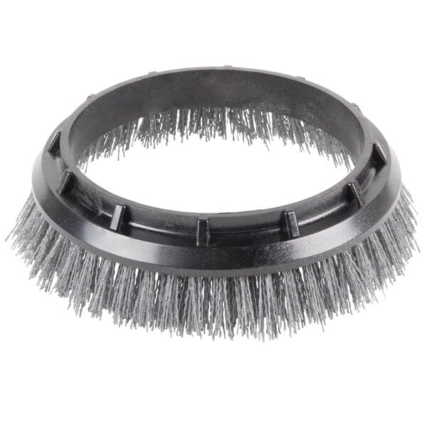 An Oreck 12'' grit scrub brush with grey bristles.