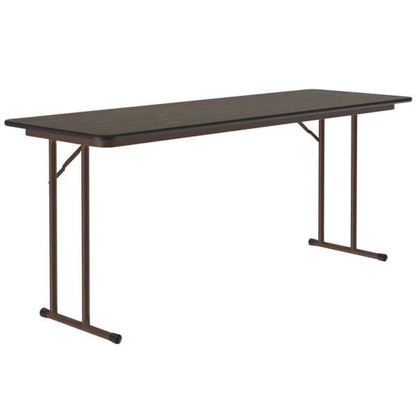 A rectangular Correll walnut seminar table with metal legs.