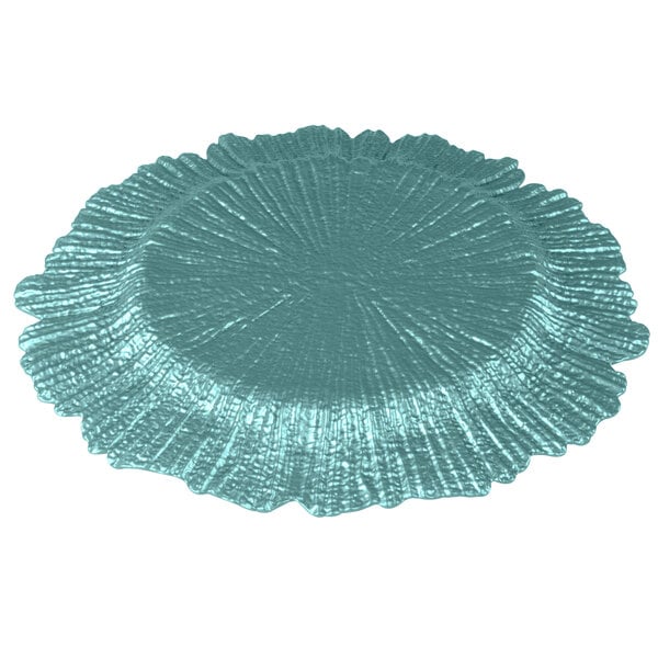 A close-up of a teal blue Charge It by Jay Reef charger plate with a scalloped edge.