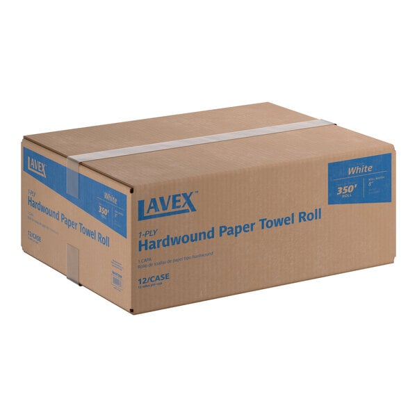 A cardboard box containing 12 rolls of Lavex white hardwound paper towels, each roll 350 feet long.
