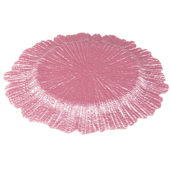 A set of 12 pink glass charger plates with a scalloped edge and a large circular design.