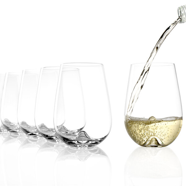 A close-up of a Stolzle stemless wine glass with white wine being poured into it.