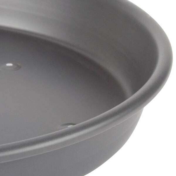 A Chicago Metallic BAKALON deep dish pizza pan with a perforated base.