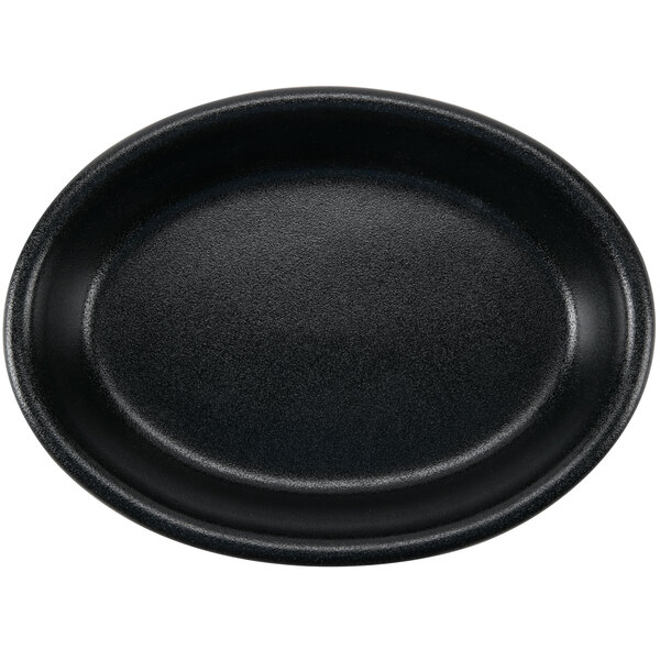 A black oval Hall China baker dish.