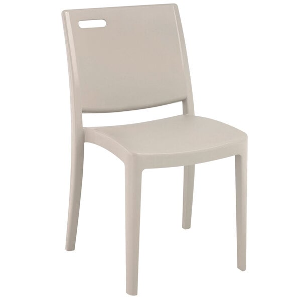 A case of 16 white Grosfillex Metro stacking chairs.