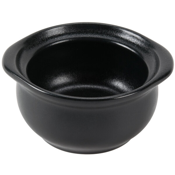 A Hall China black onion soup bowl on a white background.