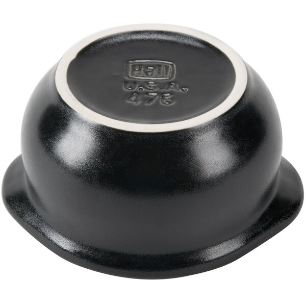 A black Hall China onion soup bowl with a white rim.