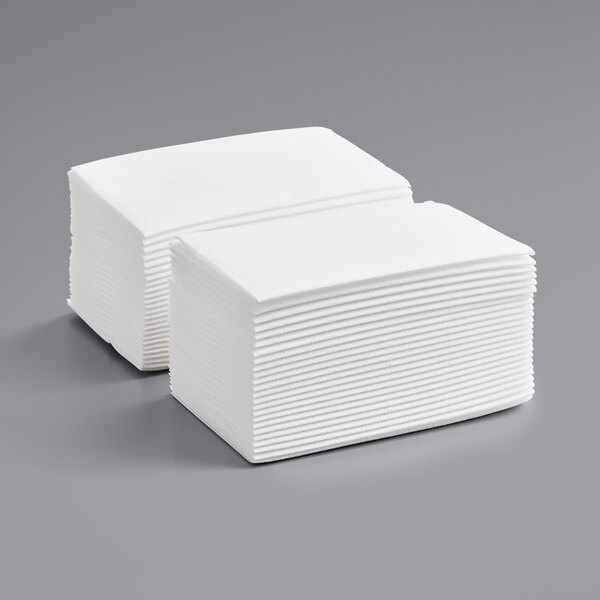 A stack of white linen-feel Choice dinner napkins.
