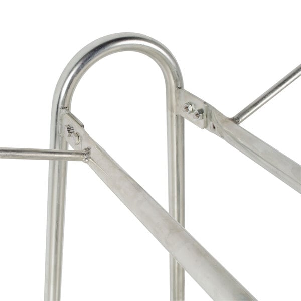 A metal rack with two hooks on it.