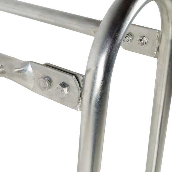 A metal frame with bolts designed to hold 10 floor mats.