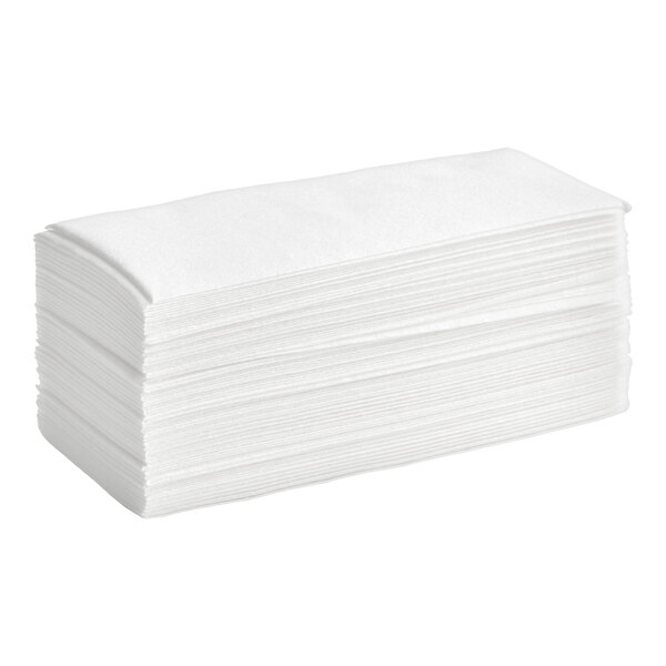 A stack of white linen-feel guest towels folded in a 1/6 style.