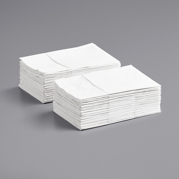 A stack of white ReadyNap pocket fold dinner napkins.
