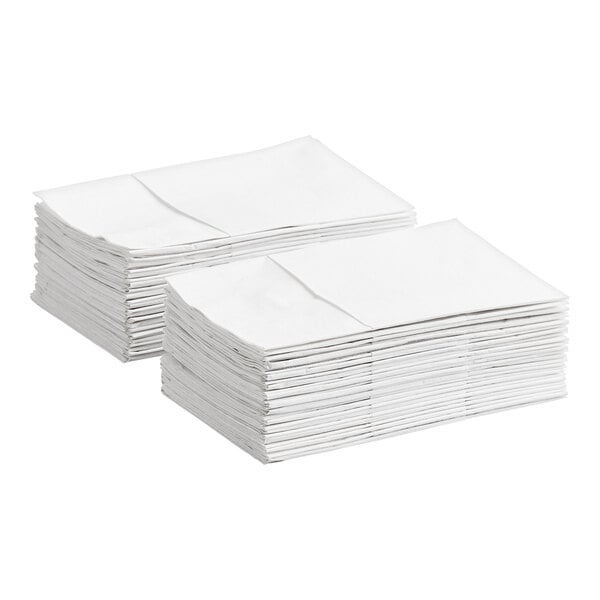 A stack of white pocket fold dinner napkins.