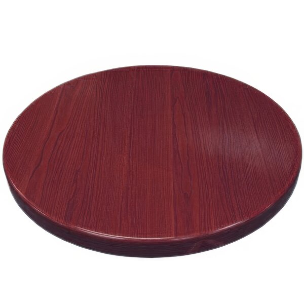 An American Tables & Seating round mahogany table top.