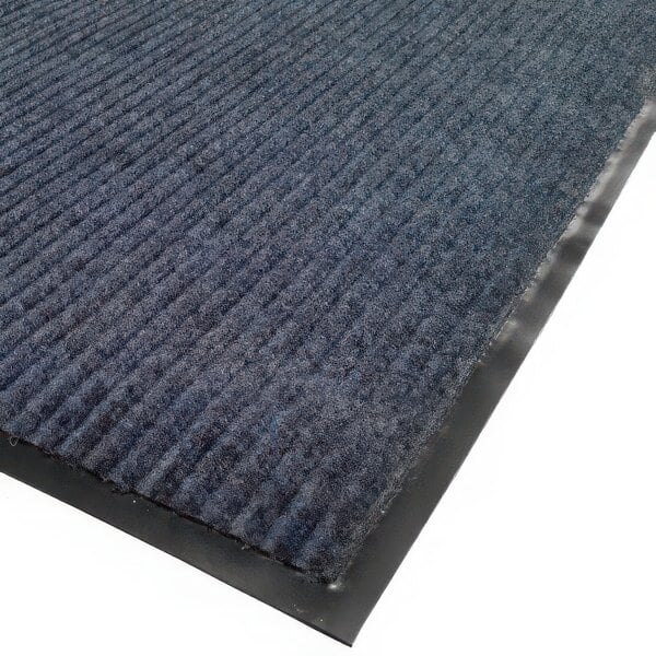 A blue needle rib carpet mat with black rubber strips.