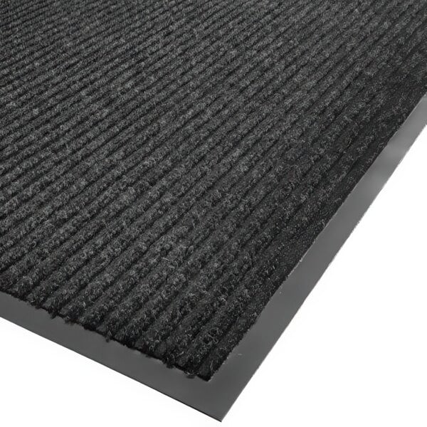 A close-up of a black carpet with a gray border.