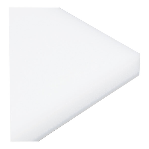 A close-up view of a white, rectangular, flat plate with smooth edges.