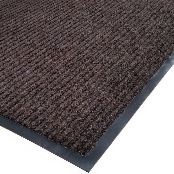 A brown Cactus Needle Rib carpet mat roll with black trim.