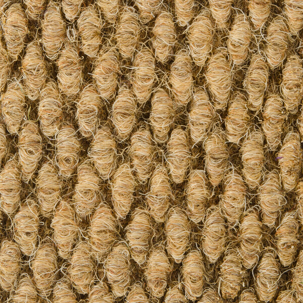 A close up of a brown jute carpet with white threads.