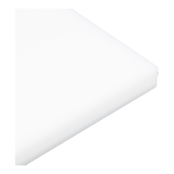A close-up view of a white, rectangular, solid plate with smooth edges.