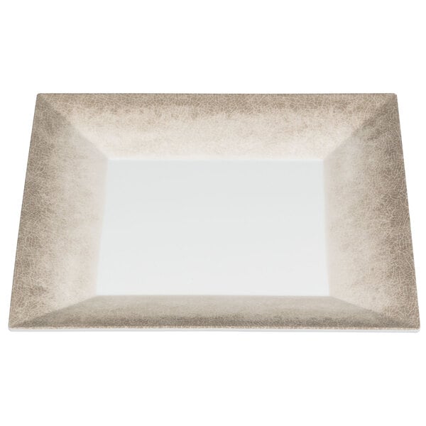 A white square plate with a tan border.