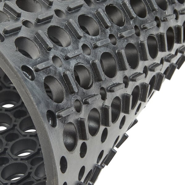 A black rubber Cactus Mat with holes.