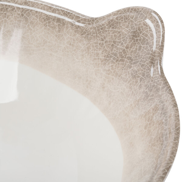 A white melamine bowl with a brown crackle-finished border and side handles.