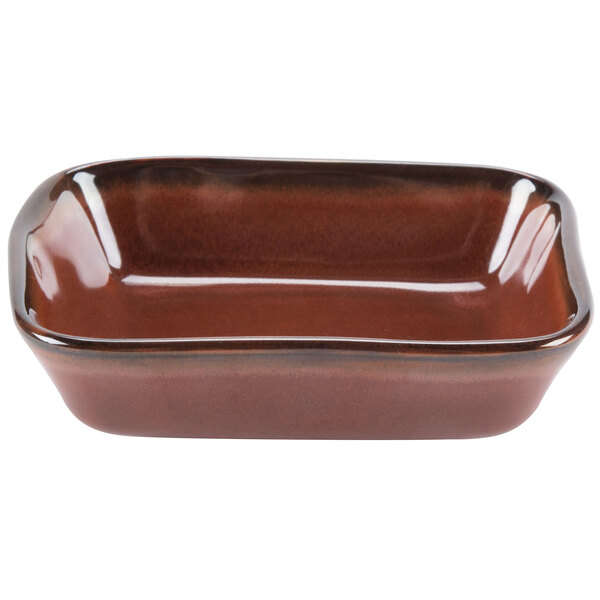 A brown rectangular ceramic dish with a brown rim.