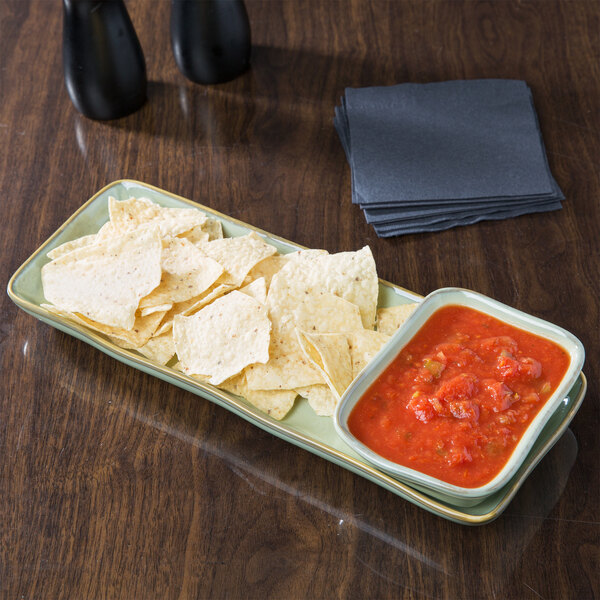 A TuxTrendz Artisan Sagebrush china tray with chips and salsa on it on a table.