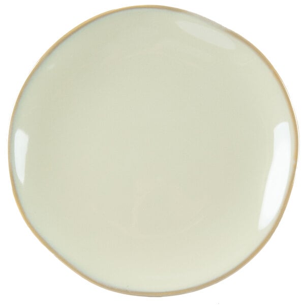 A white Tuxton china plate with a gold rim.
