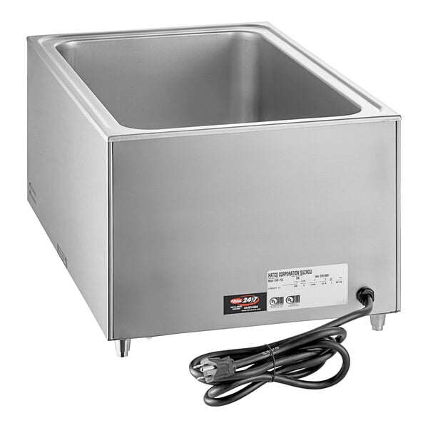A stainless steel square countertop food warmer with a black cord.