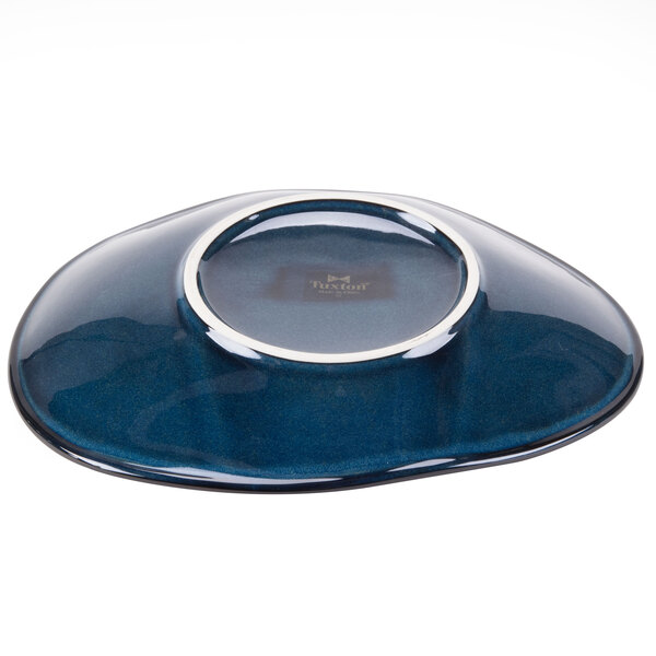 A blue ellipse-shaped Tuxton china plate with a silver rim.