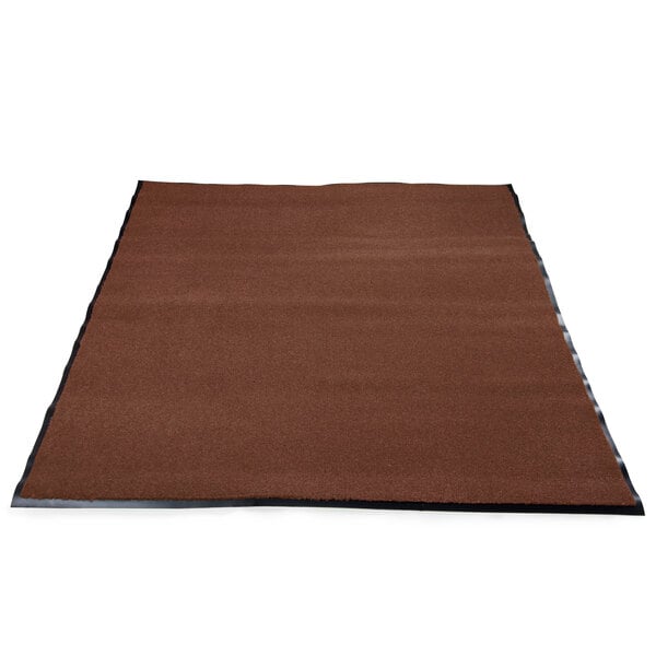 A roll of chocolate brown carpet with a black border.