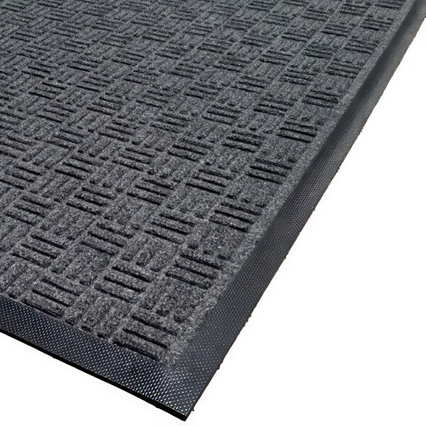 A close up of a black Cactus Mat with a gray border.