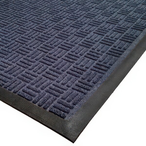 A navy blue carpet mat with black squares in a parquet pattern.
