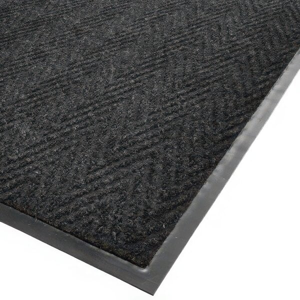 A black Cactus Mat with a grey herringbone border.