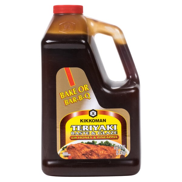 A bottle of Kikkoman Teriyaki Baste and Glaze with Honey and Pineapple.