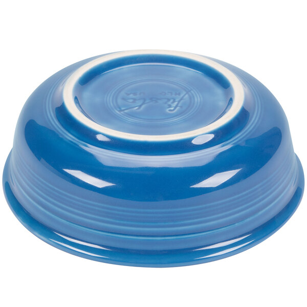 A blue bowl with a white rim.