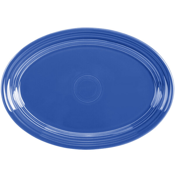 A blue oval china platter with a white background.