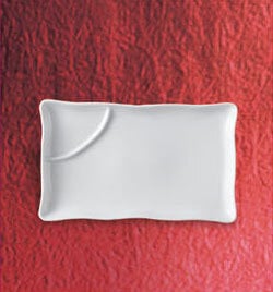 A white rectangular divided sauce plate.