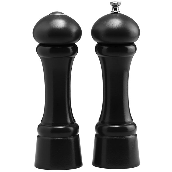 A black round pepper mill and salt shaker set with a white background.