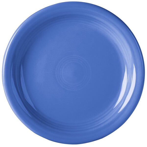 A close-up of a Fiesta® Lapis China appetizer plate with a blue rim.