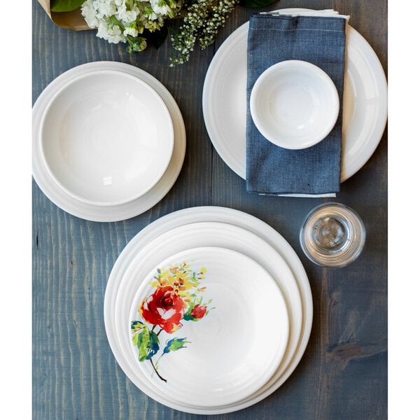 A white Fiesta Bistro bowl on a blue surface.