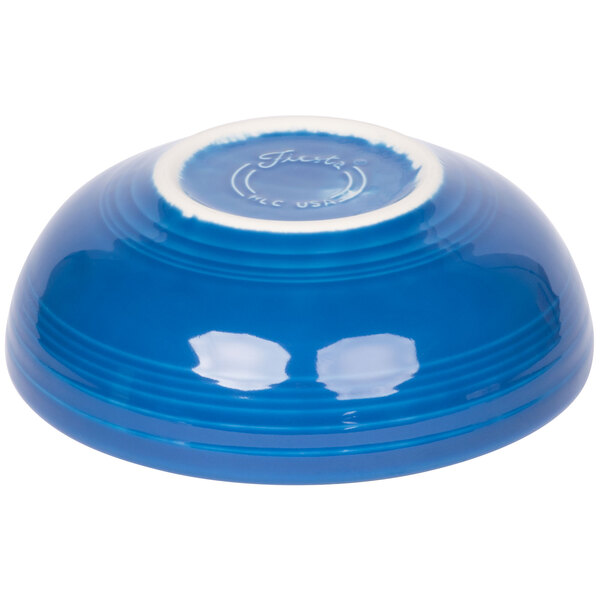 A close-up of a Fiesta Lapis china bistro bowl with a white edge.