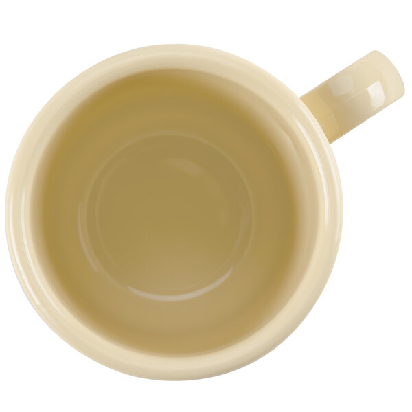 A close up of a white GET Diamond Harvest Squash Tritan mug with a handle.