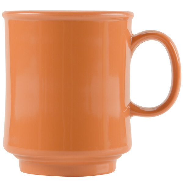 An orange GET pumpkin mug with a handle.