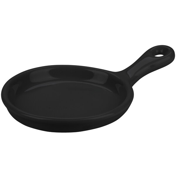 A black pan with a handle.