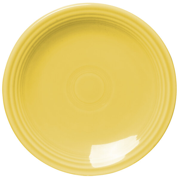 A Fiesta® Sunflower yellow bread and butter plate with a white rim.