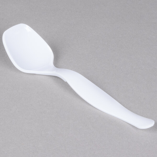 A Fineline white plastic serving spoon.