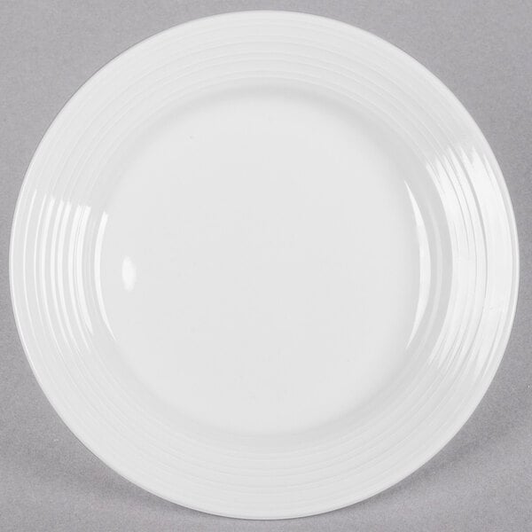 A Tuxton Pacifica bright white china plate with a circular edge.